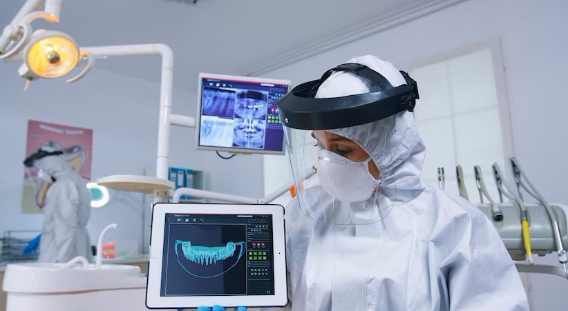 Dentist shows patient's dental problems analyzed by artificial intelligence