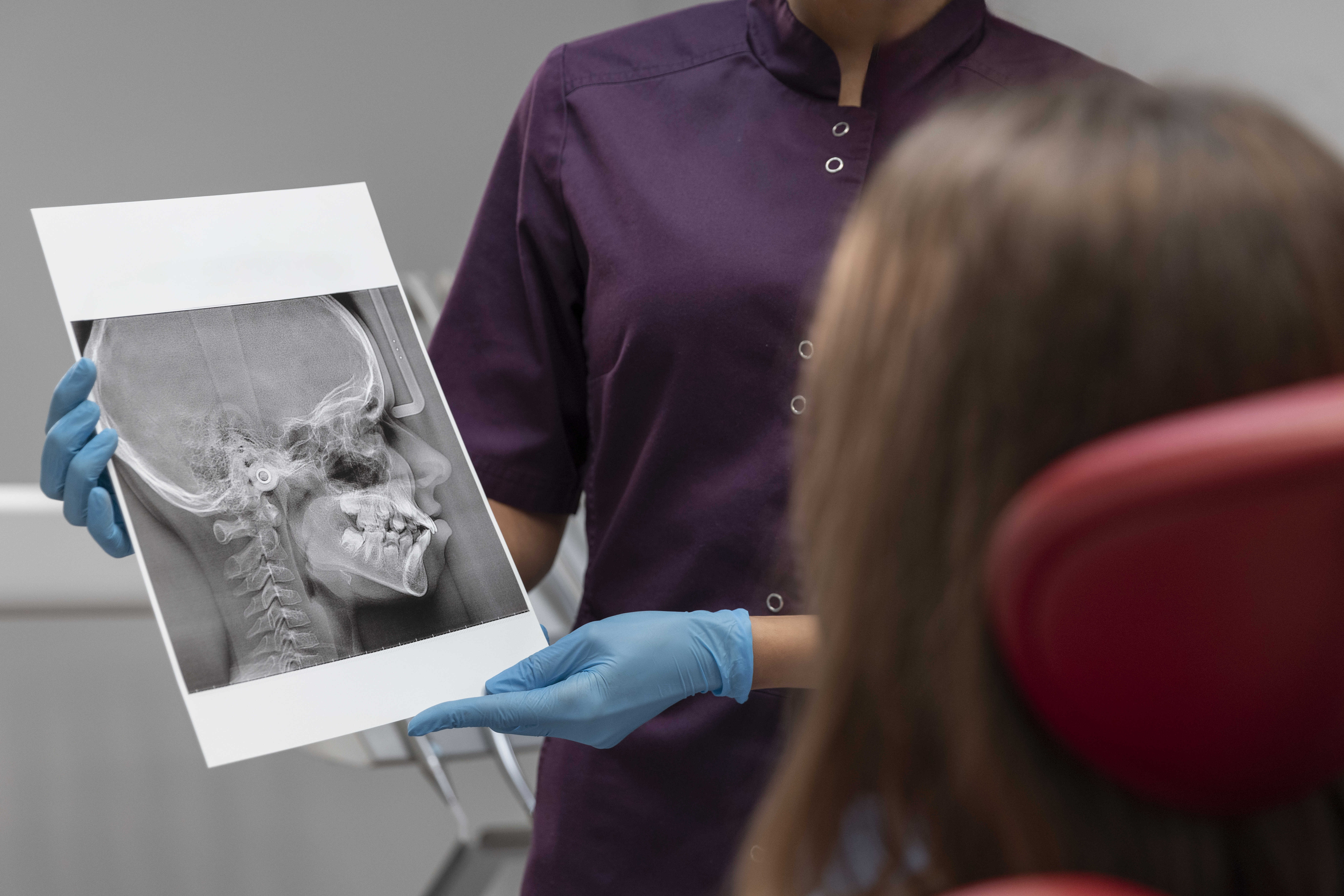 A dentist presenting a dental imaging 3D report