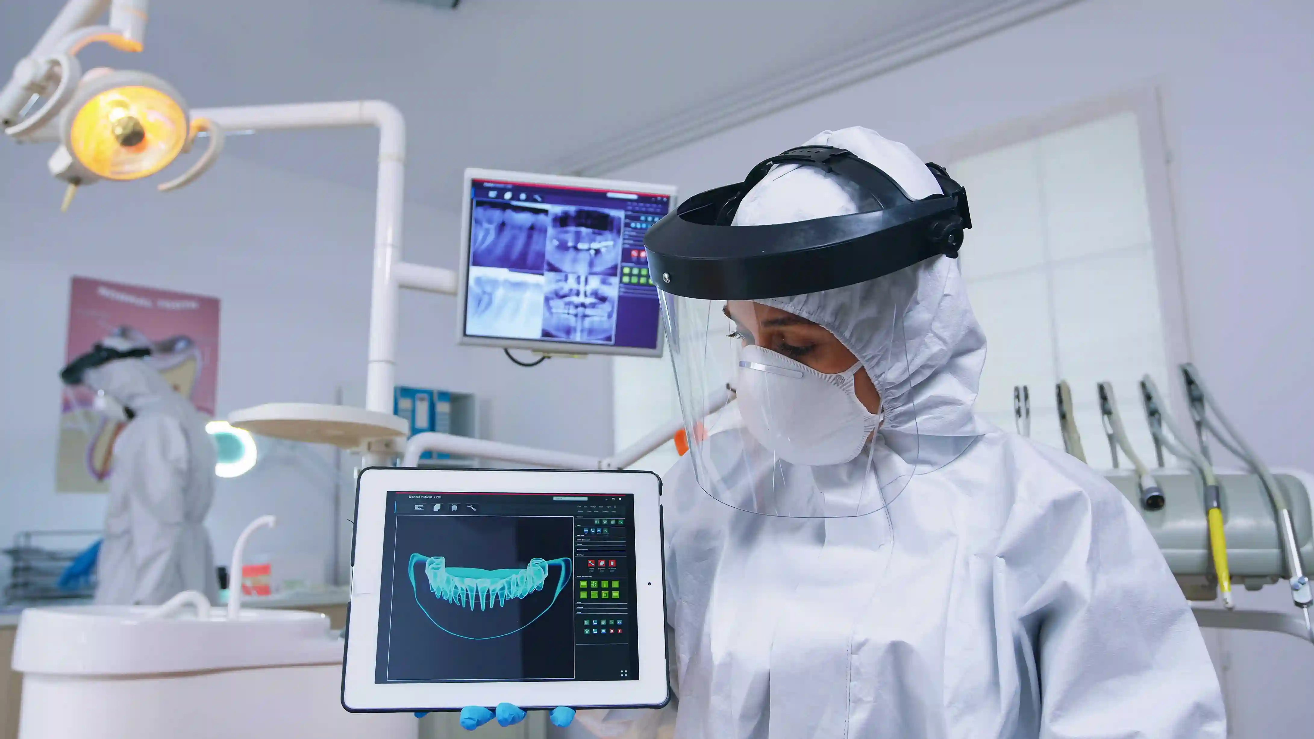 In a dental practice showing dental X-ray images on a tablet screen